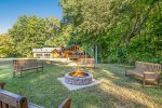 Wonderful setting with a sprawling lawn and fire pit area